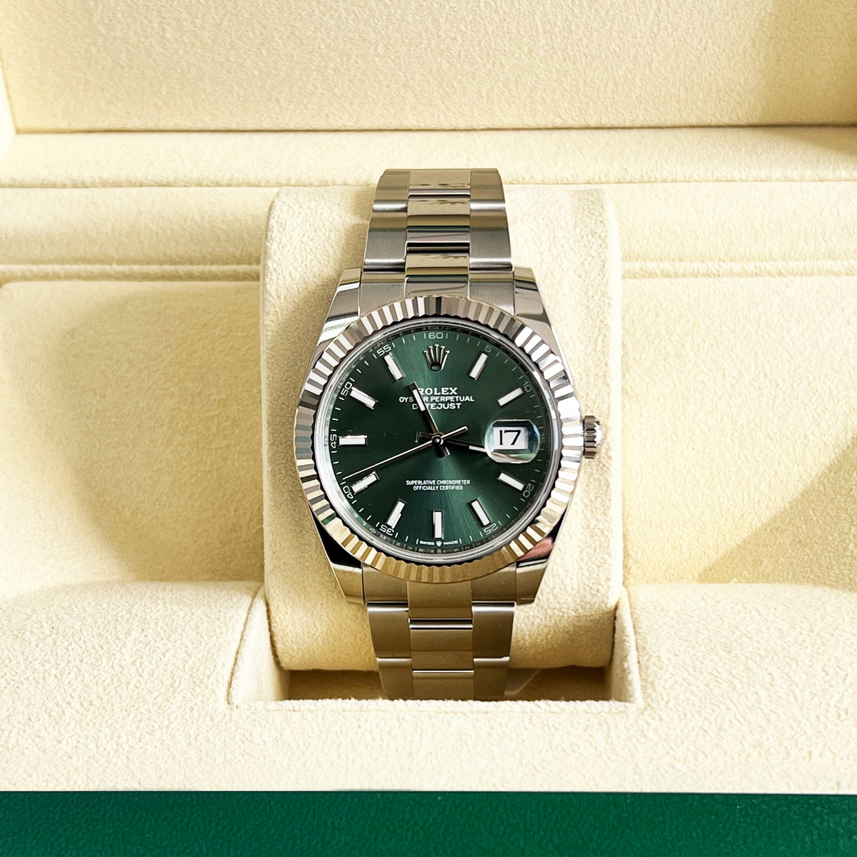Rolex Datejust 41mm Green Dial Watch 126334-0028 with a silver-tone finish, fluted bezel, and Jubilee bracelet, displayed inside a presentation box.