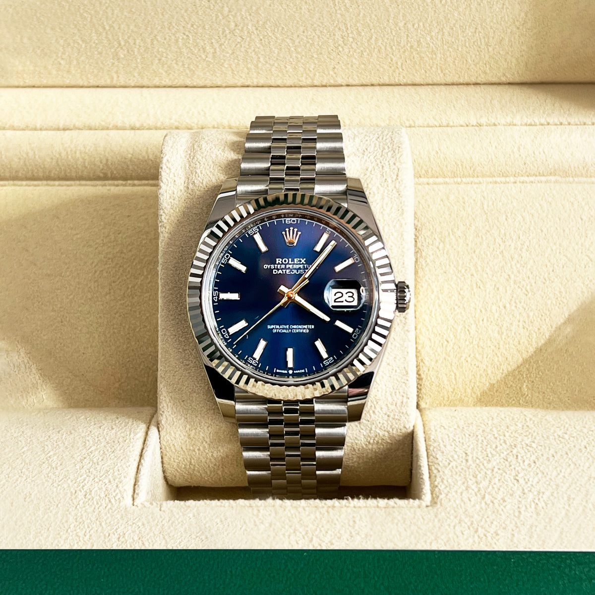 Rolex Datejust 41mm Blue Dial Watch | 126334 with a blue dial, fluted bezel, and Jubilee bracelet, displayed on a watch cushion inside a case.