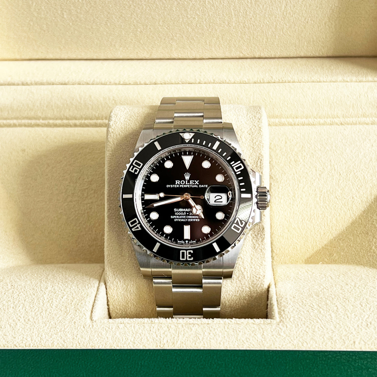 A stainless steel Rolex Submariner Date 41mm Black Dial Watch | 126610LN with a black dial and rotating bezel, displayed on a watch pillow inside a box.