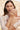 Woman holding a baby with a blurred natural background