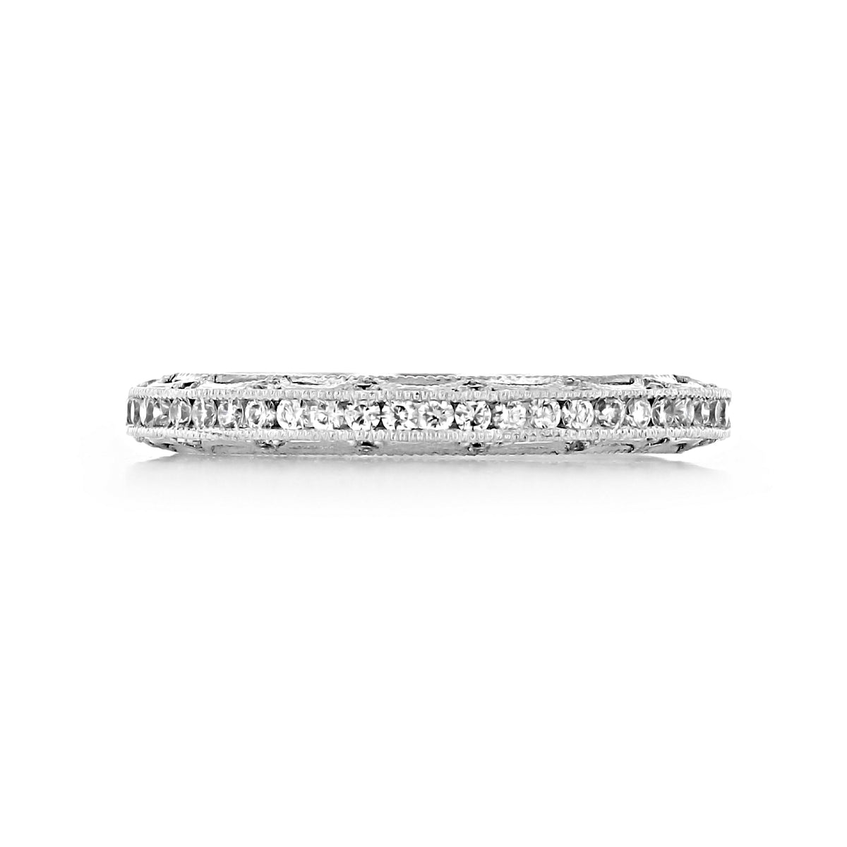 A white metal Reverse Crescent | Diamond Band - 2617B12W eternity wedding band featuring a channel of round diamonds with intricate Tacori crescent metalwork along the edges.