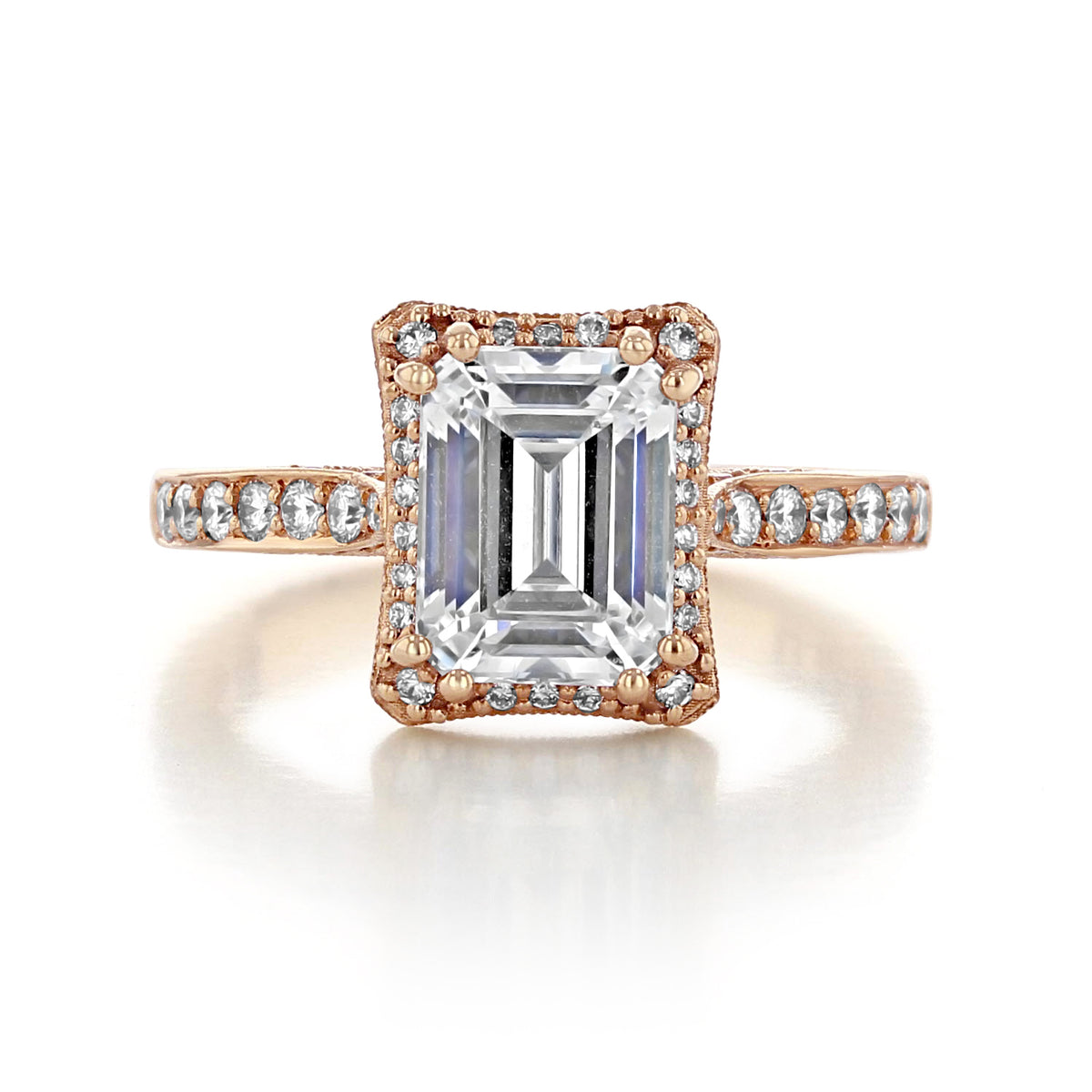 Dantela | Emerald Bloom Engagement Ring - 2620ECLGPPK in rose gold featuring an emerald-cut center stone surrounded by a diamond halo and accented with pavé-set diamonds along the band.