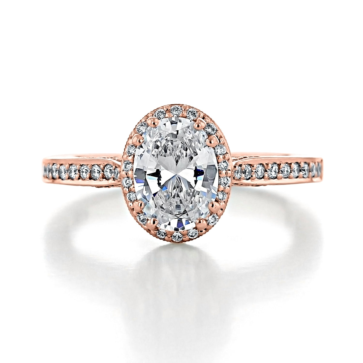 Tacori Dantela | Oval Bloom Engagement Ring 2620OVSMPPK in rose gold featuring an oval-cut diamond with a diamond halo and pavé-set diamond band.