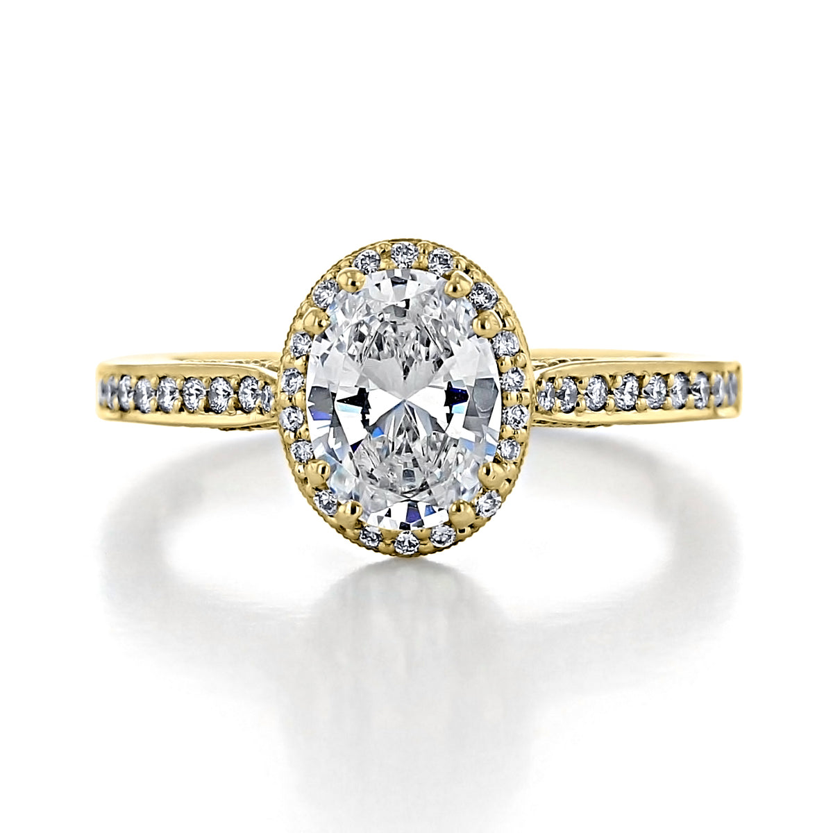 Tacori Dantela | Oval Bloom Engagement Ring 2620OVSMPY featuring an oval-cut diamond on a yellow gold band with a pavé-set halo and diamond-accented shoulders.