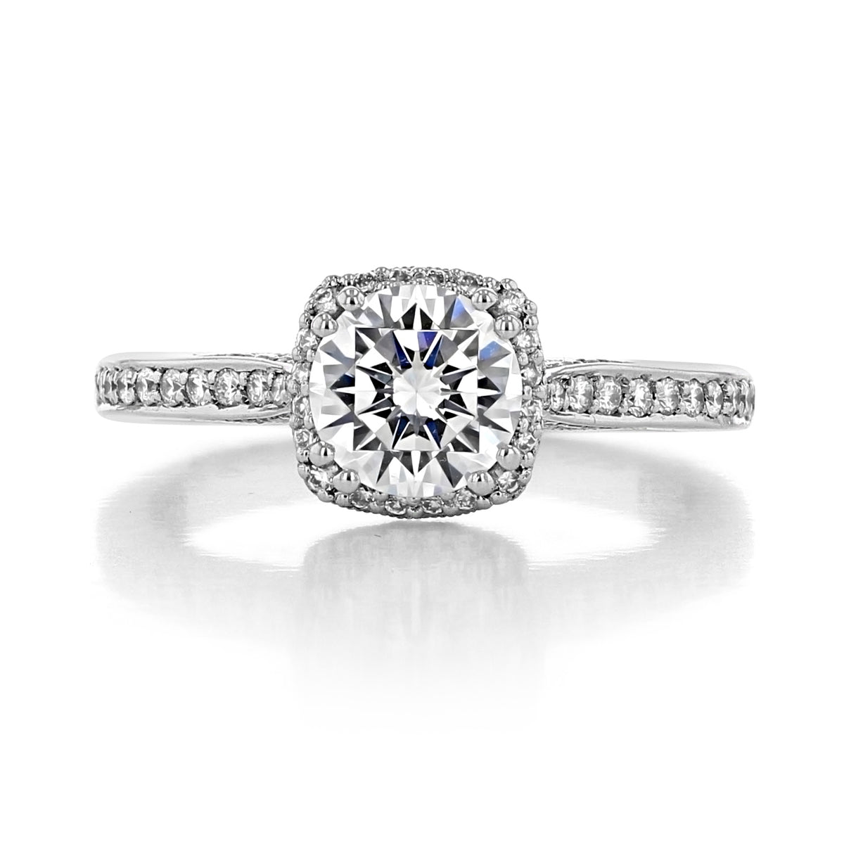 A vintage-inspired Tacori Dantela | Round Bloom Engagement Ring - 2620RDSMP featuring a round-cut diamond in a halo setting with pavé-set diamonds on the band.