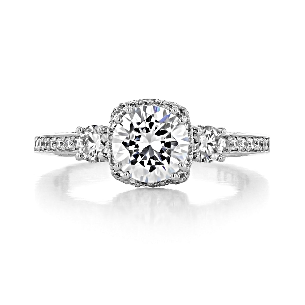 Tacori Dantela | Round Bloom Engagement Ring 2623RDSMPW featuring a three-stone design with a large round center diamond, decorative metal border, two smaller side stones, and a pavé-set band.