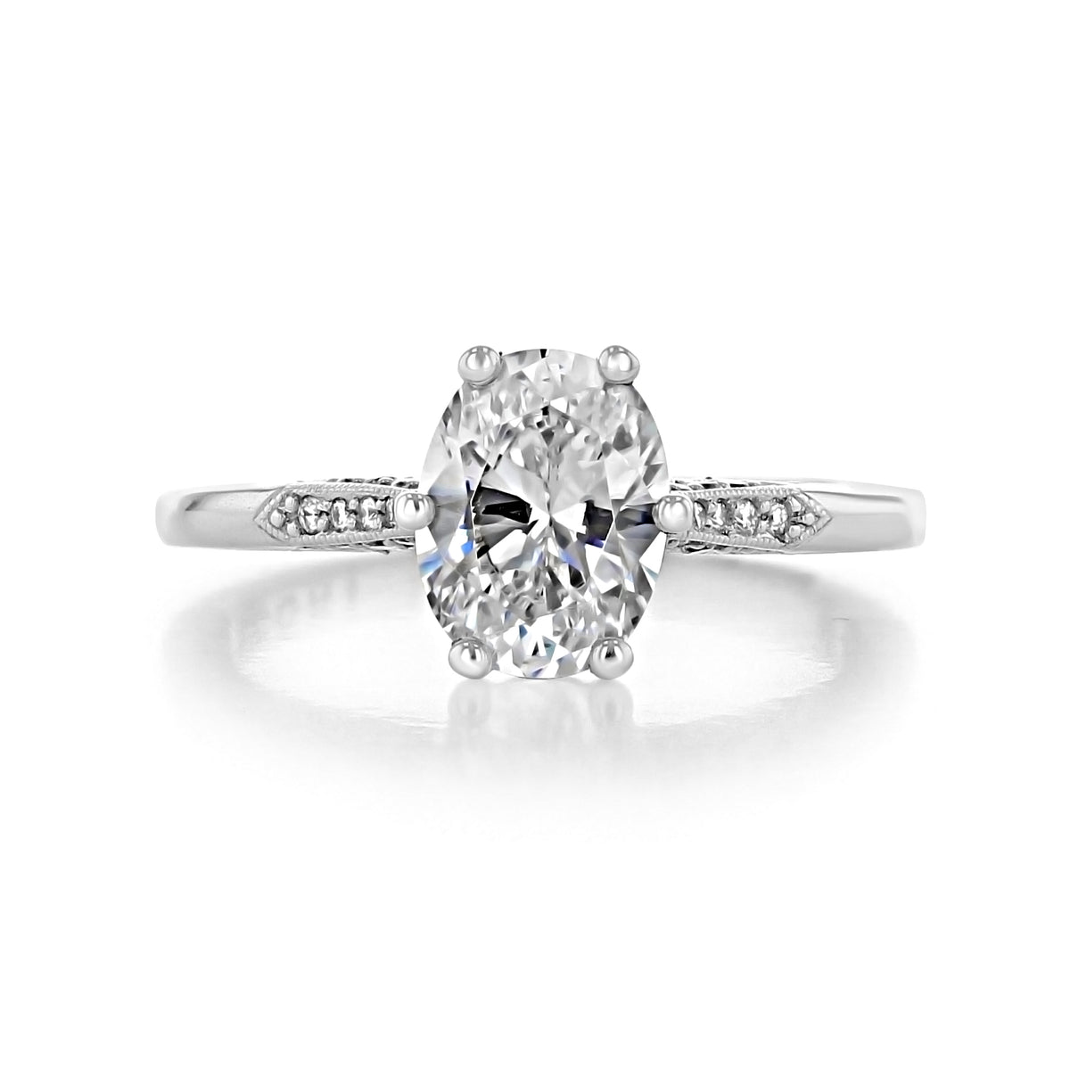 Simply Tacori Oval Solitaire Engagement Ring - 2651OV85X65 featuring an oval solitaire diamond, a pavé-set band, and intricate metal detailing on a white background.