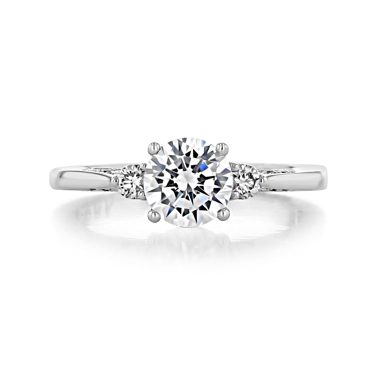 A Simply Tacori | Round 3-Stone Engagement Ring - 2656RD65 featuring a round center diamond flanked by two smaller round diamonds on a polished metal band.