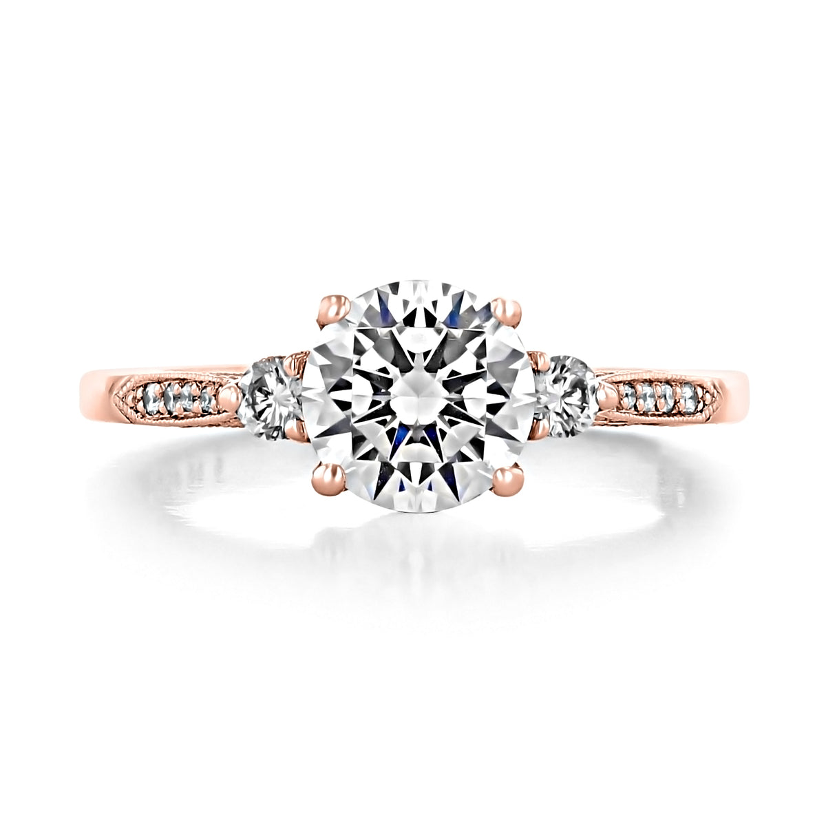 Simply Tacori Round 3-Stone Engagement Ring - 2657RD7PK in rose gold with a large round center diamond flanked by two smaller round diamonds.