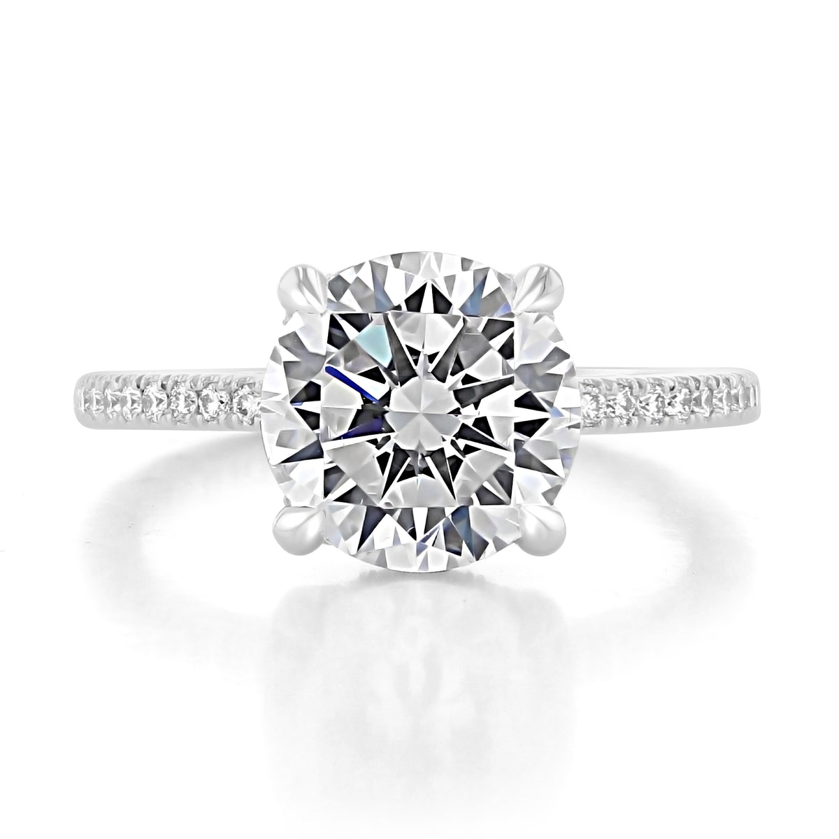 A Simply Tacori | Round Solitaire Engagement Ring - 267015RD95W featuring a round-cut diamond solitaire, a diamond-studded basket, and a pavé-set white gold band.