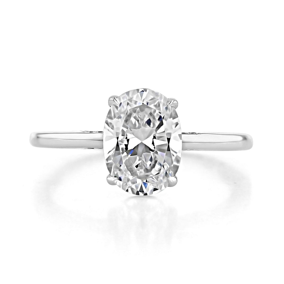 Simply Tacori | Oval Solitaire Engagement Ring - 268215OV95X7W featuring an oval-cut solitaire on a plain metal band with diamond-filled crescents.