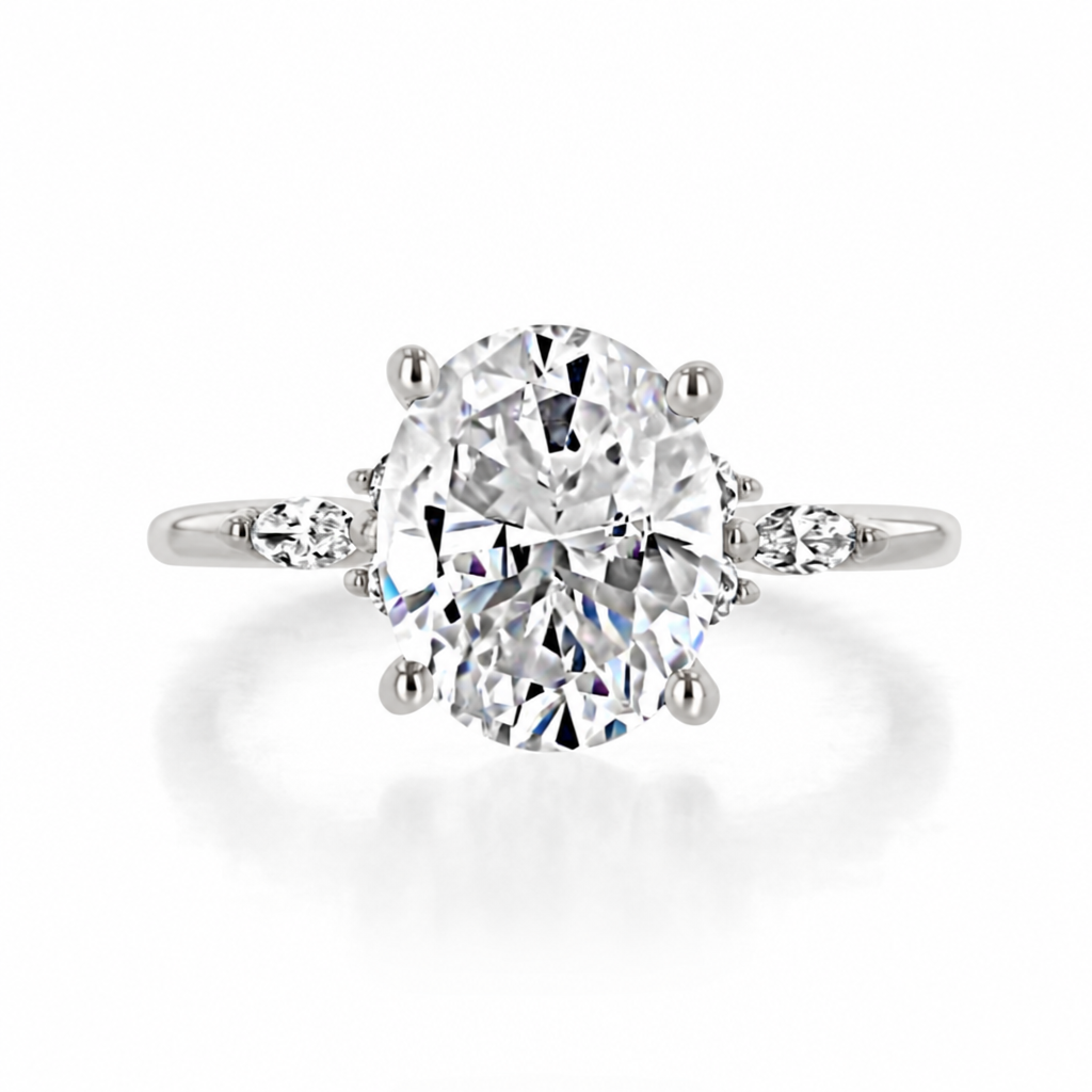 Poppy | Oval Floral Diamond Engagement Ring in 14k white gold, top view of an oval center diamond with a trio of side diamonds on each side.