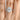 Simply Tacori | Oval Bloom Engagement Ring - 267615OV95X7W featuring an oval-cut diamond with a cushion-shaped bloom halo and pave diamond band in 18k white gold, worn on a finger.