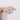 Danhov Abbraccio | Swirl Engagement Ring - AE135 in rose gold featuring a round center stone set in a braided band that swirls around the diamond.