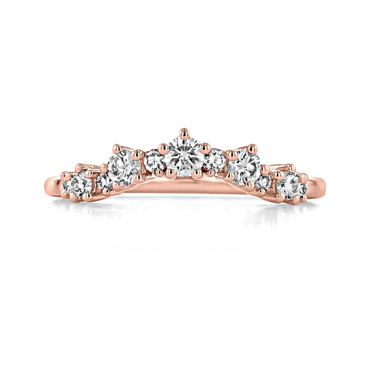 Riviera | Curved Prong-Set Diamond Wedding Band in rose gold, featuring a row of prong-set diamonds that increase in size toward the center.