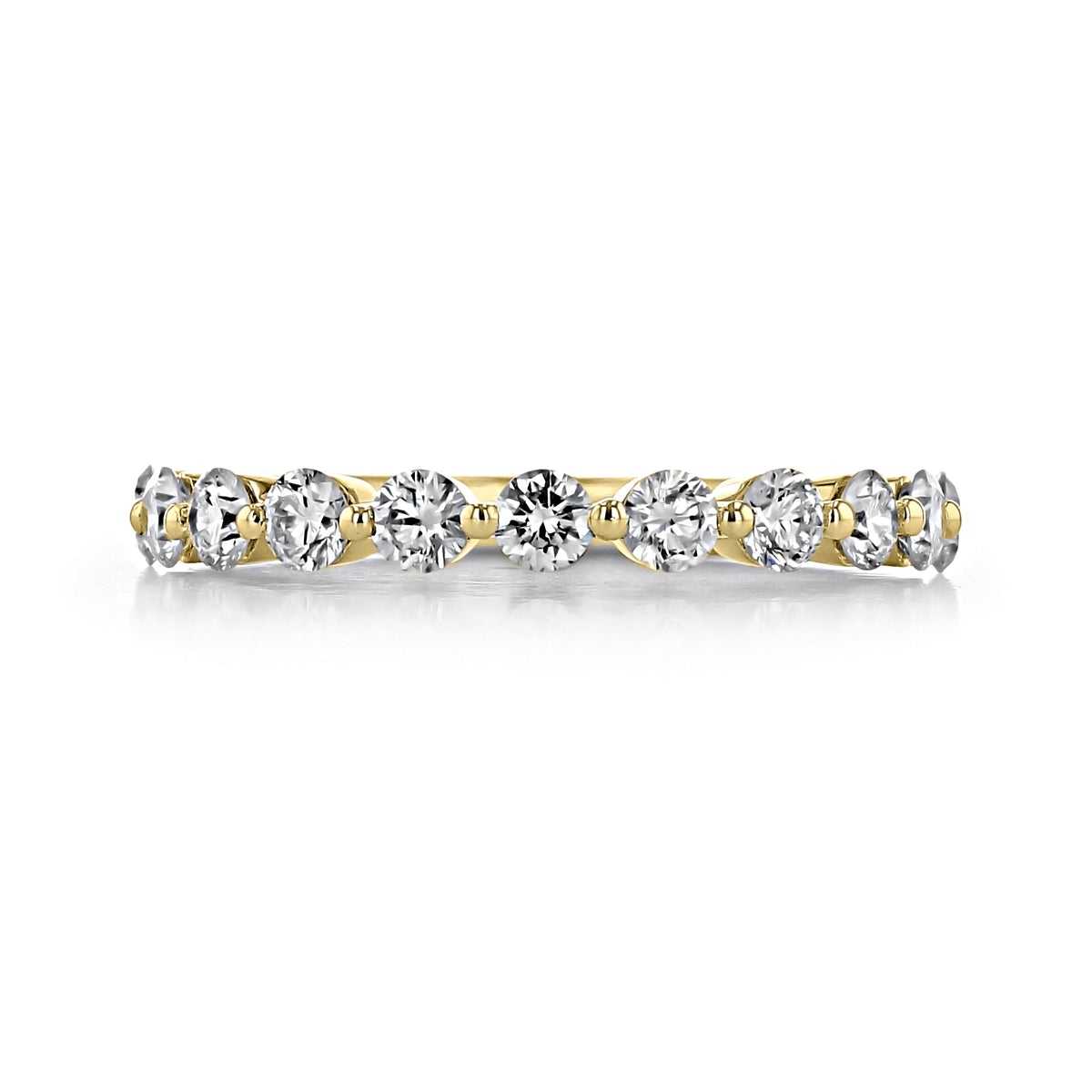 A yellow gold Delrosa | 2.15mm Prong-Set Diamond Wedding Band by Gabriel NY featuring a row of round-cut diamonds held in place by small prongs.