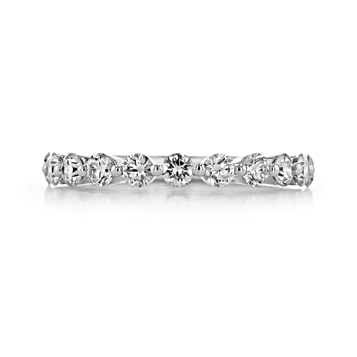 A thin metal Delrosa | 2.15mm Prong-Set Diamond Wedding Band by Gabriel NY featuring a row of round, prong-set stones.