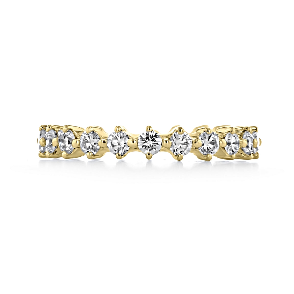 Eden | Compass Prong-Set Diamond Wedding Band in gold, featuring a row of round-cut diamonds in compass prong settings.