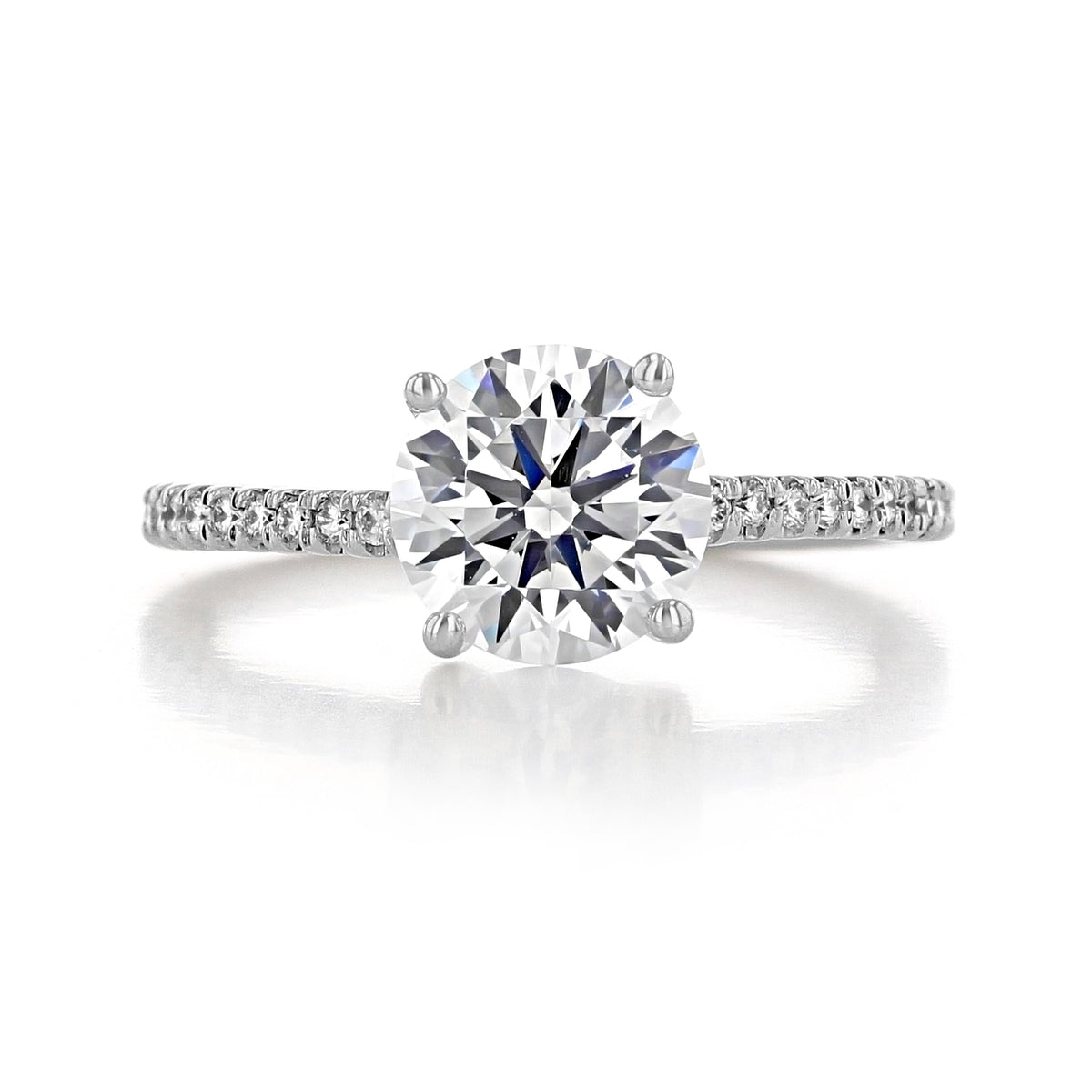 Sierra Round Micro-Prong Engagement Ring featuring a round brilliant-cut diamond and a micro-prong pavé band.