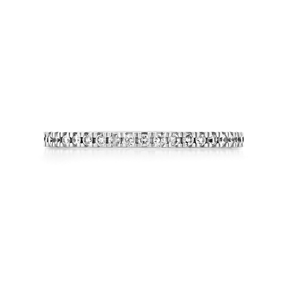 A thin 14k white gold Estelle | 1.60mm Diamond Eternity Band set with a continuous row of small round diamonds, perfect as a stackable wedding band.