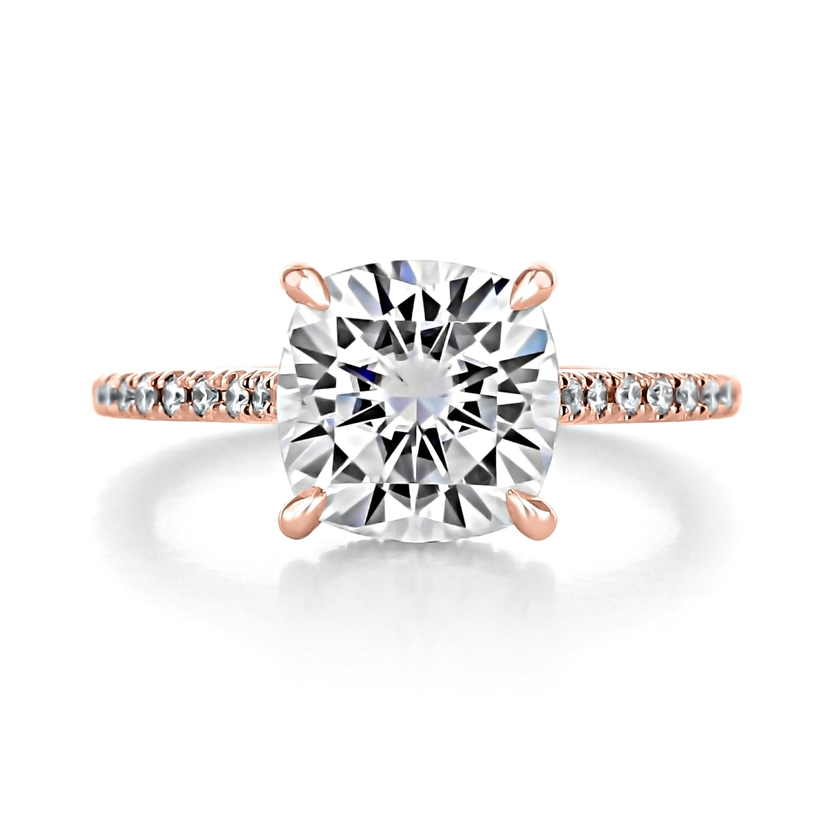 Delaney Cushion Hidden Halo Engagement Ring featuring a cushion-cut diamond on a rose gold band with pavé-set stones and a hidden halo.