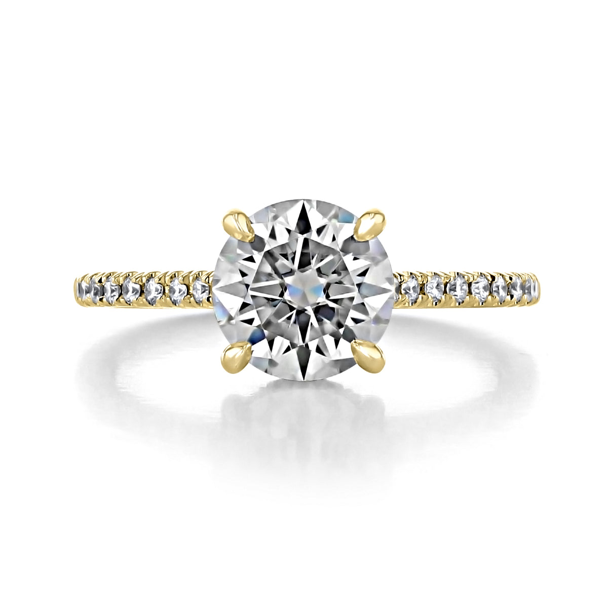 Delaney | Round Hidden Halo Engagement Ring featuring a round diamond on a gold band with a hidden halo of micro-prong set diamonds.