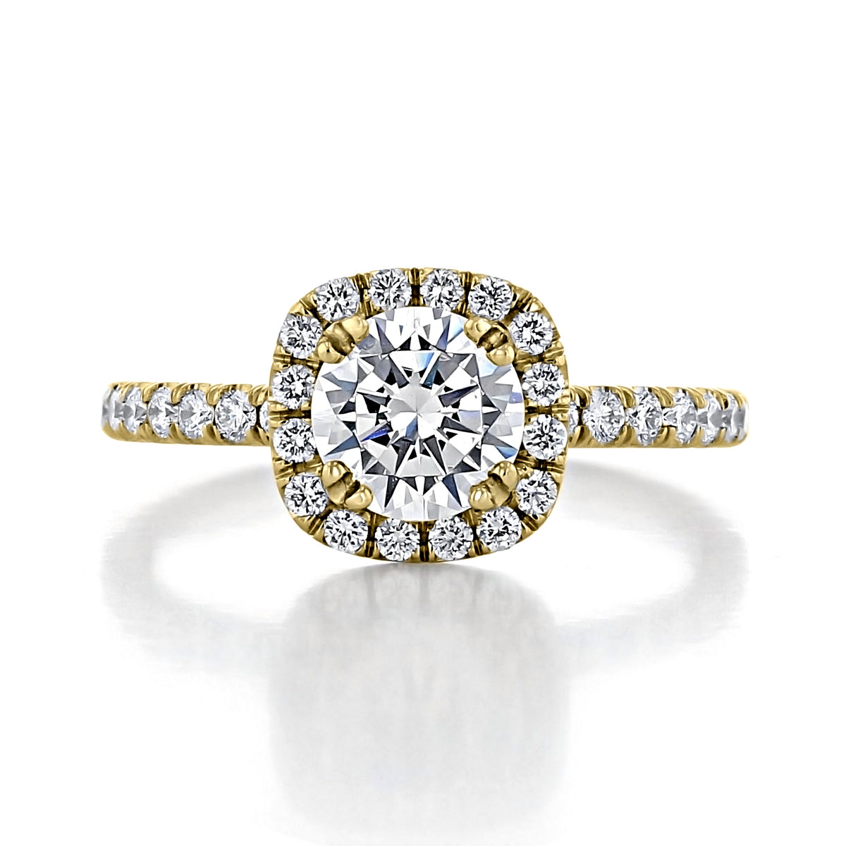 Toluca | Round Halo Engagement Ring in gold featuring a round-cut center stone surrounded by micro-prong set diamonds, with additional diamonds set along the band.