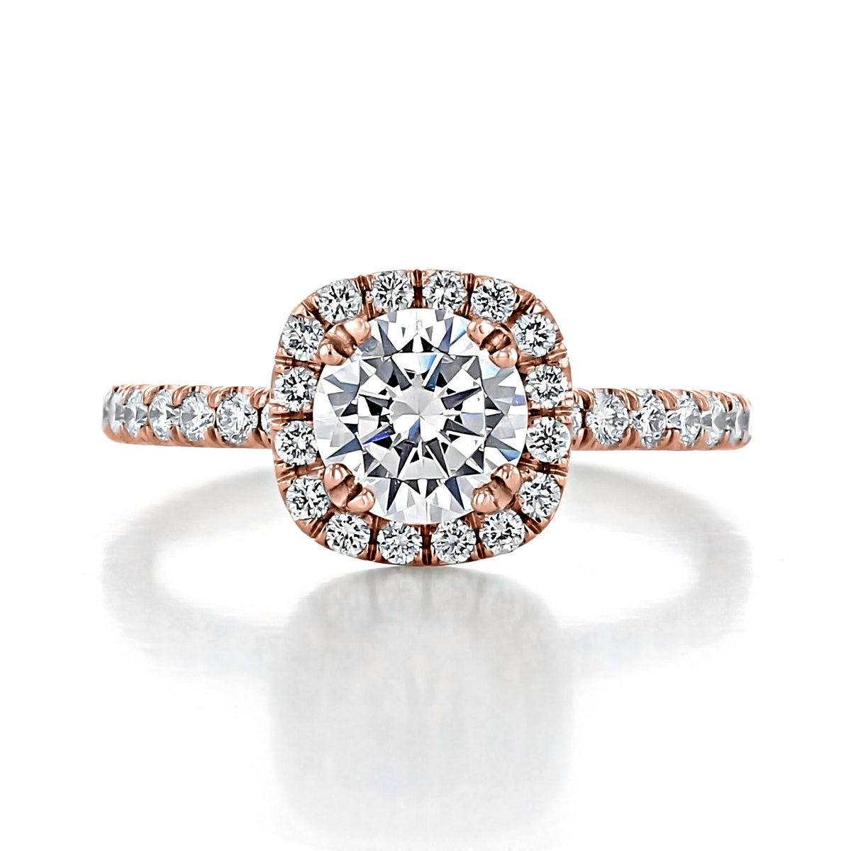 Toluca | Round Halo Engagement Ring in rose gold with a round center stone surrounded by a square border of small diamonds and micro-prong set diamonds along the band.