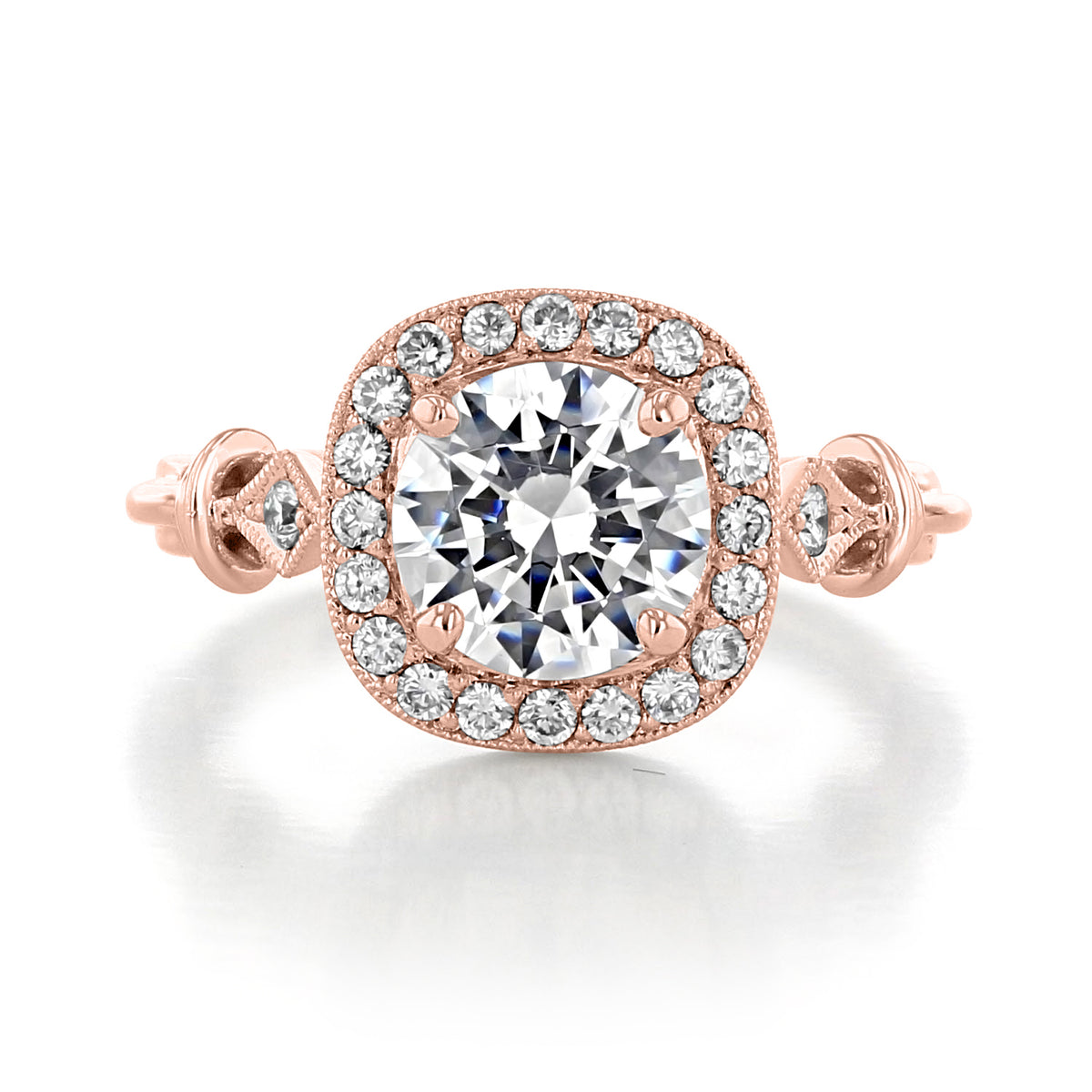Vienna | Round Halo Engagement Ring featuring a round center diamond, halo setting, and ornate metalwork on a rose-gold band.