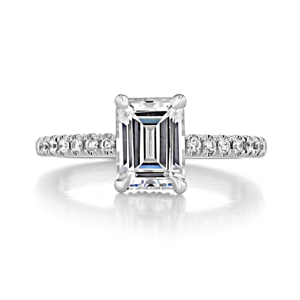 Kiara | Emerald Hidden Halo Engagement Ring featuring a rectangular emerald-cut center stone and a pavé diamond platinum band with a hidden halo.