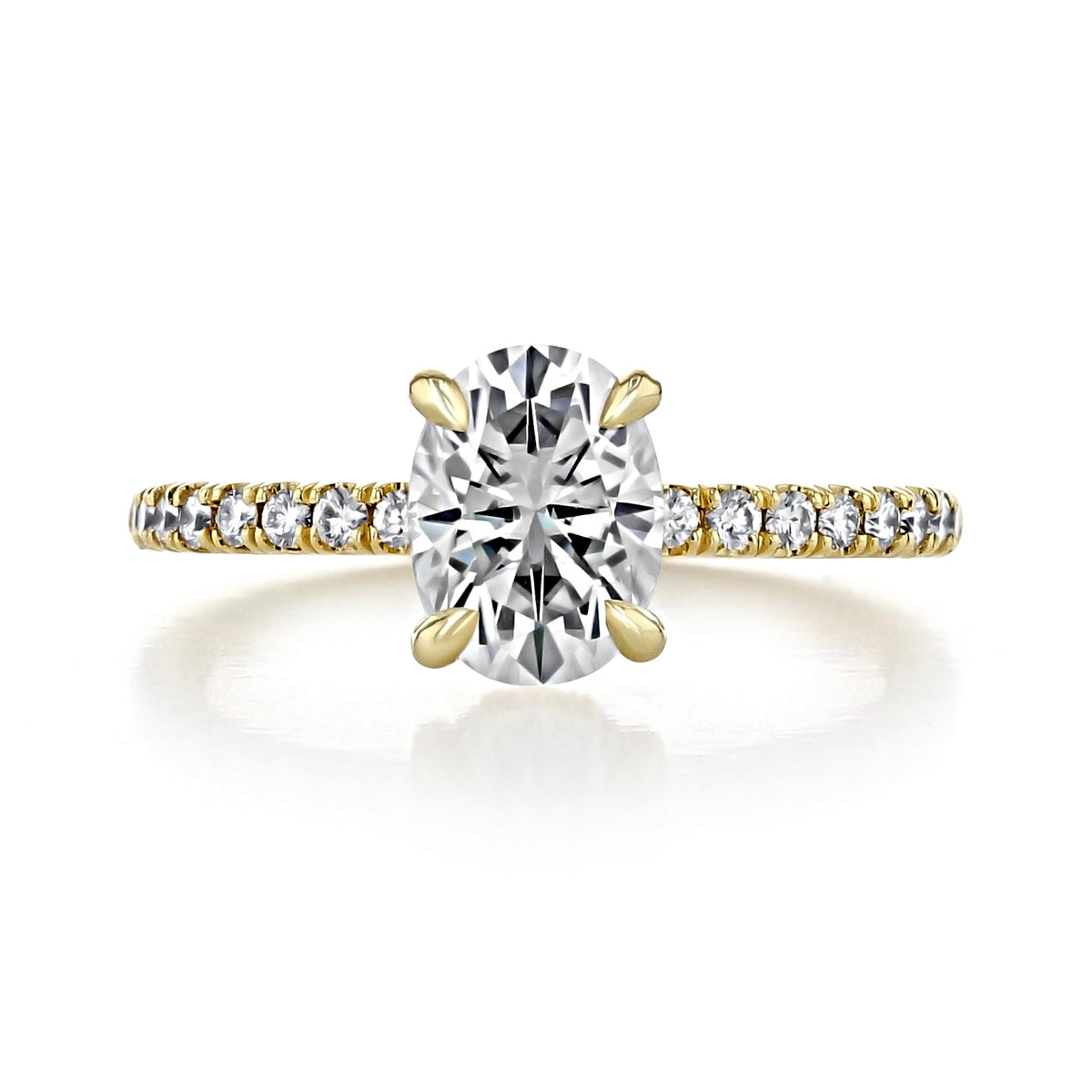 Kiara | Oval Hidden Halo Engagement Ring featuring an oval diamond on a yellow gold band with pavé diamonds.