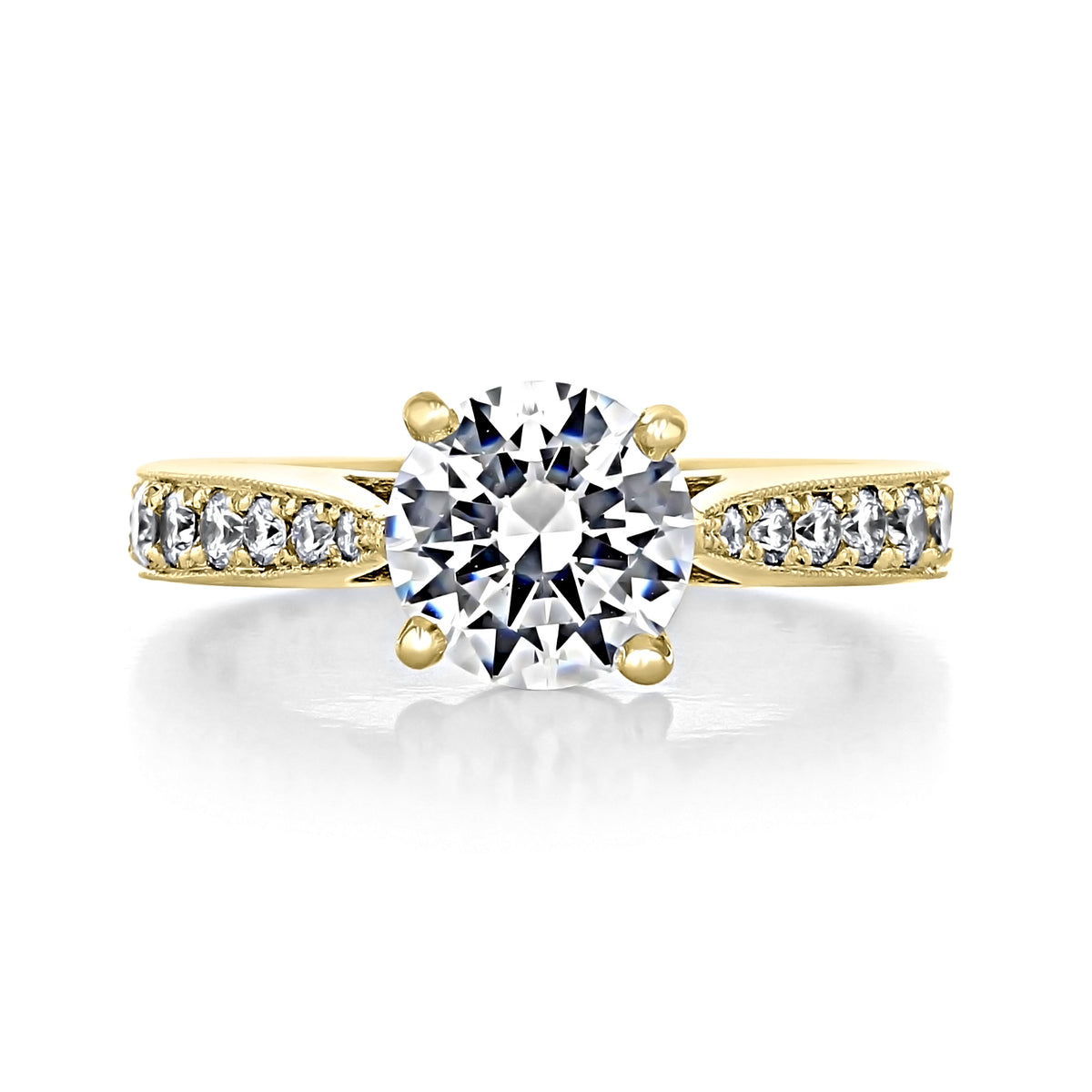Skylar | Round Pavé Engagement Ring featuring a round-cut diamond, a pavé-set yellow gold band, and delicate milgrain detailing.