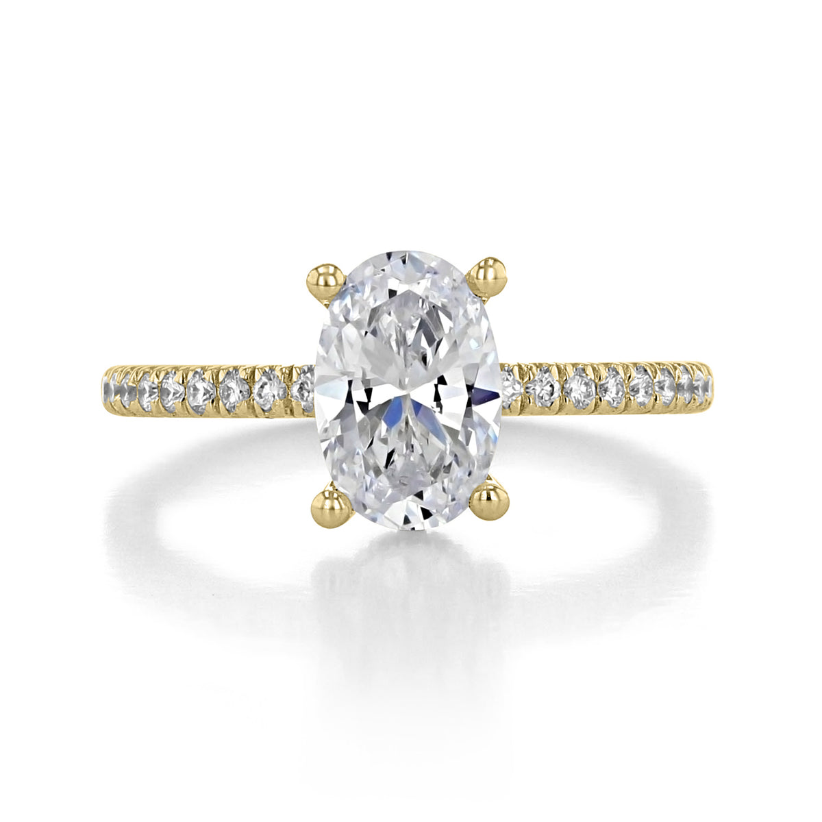 Serenity | Hidden Halo Engagement Ring by Gabriel & Co. featuring an oval diamond with a pavé diamond band set in yellow gold.