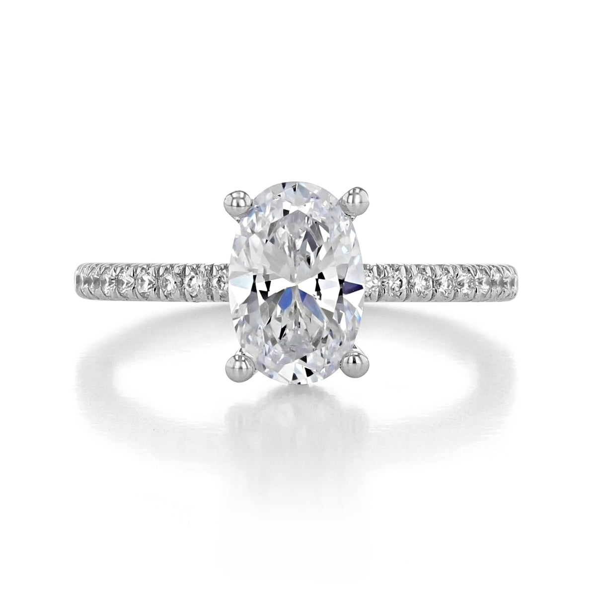 Serenity | Hidden Halo Engagement Ring by Gabriel & Co. featuring an oval-cut solitaire stone on a pavé diamond band with a hidden halo.