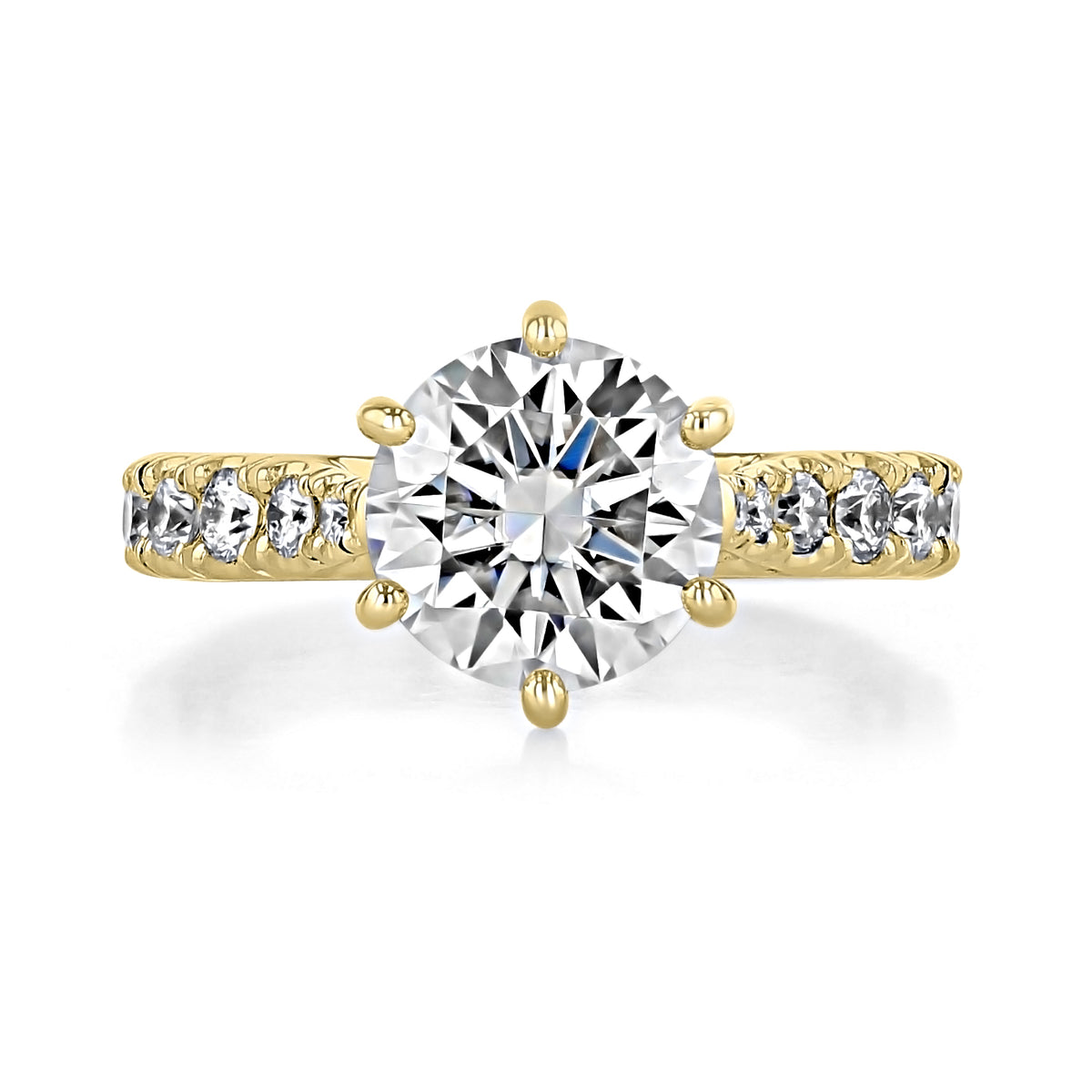 Juliet | Round Micro-Prong Engagement Ring featuring a round solitaire diamond on a gold band with micro-prong set accent diamonds.