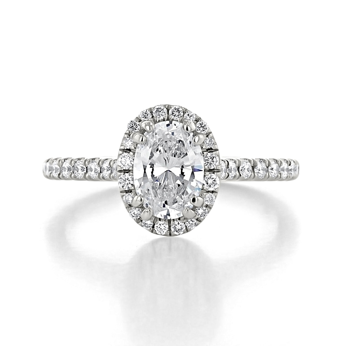 Isla oval halo engagement ring with an oval-cut diamond and pavé-set band.