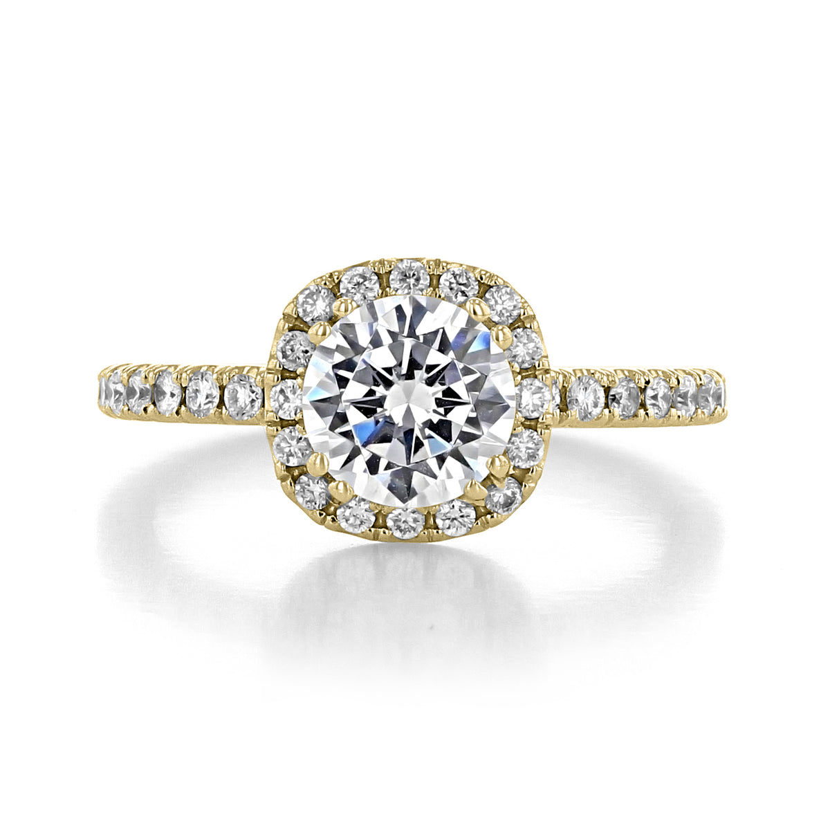 Carmelita round-cut EverTrue diamond engagement ring with a cushion-shaped bloom halo setting and micro-prong diamonds along the yellow gold band.