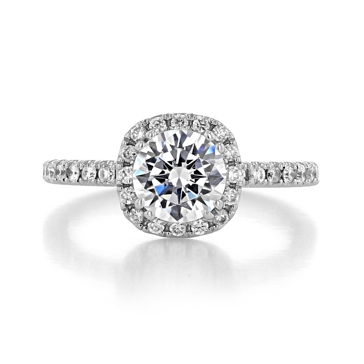 Carmelita round halo engagement ring featuring an Evertrue diamond surrounded by a cushion-shaped bloom halo and a pavé-set band.