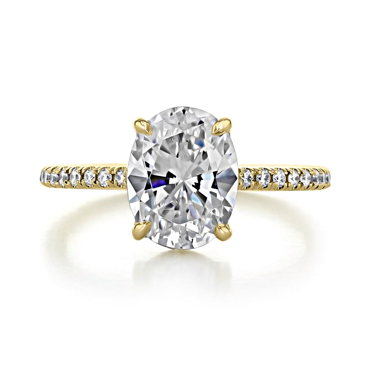 Broadway | Oval Micro-Prong Engagement Ring featuring an oval-cut solitaire diamond on a micro-prong pavé-set yellow gold band.