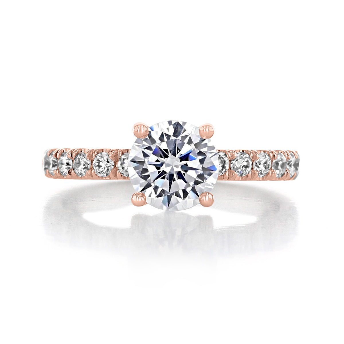 A rose gold Cambria | Round Micro-Prong Engagement Ring by evertrue by Icing On The Ring, featuring a round center diamond and small diamonds set along the band in a micro-prong setting.