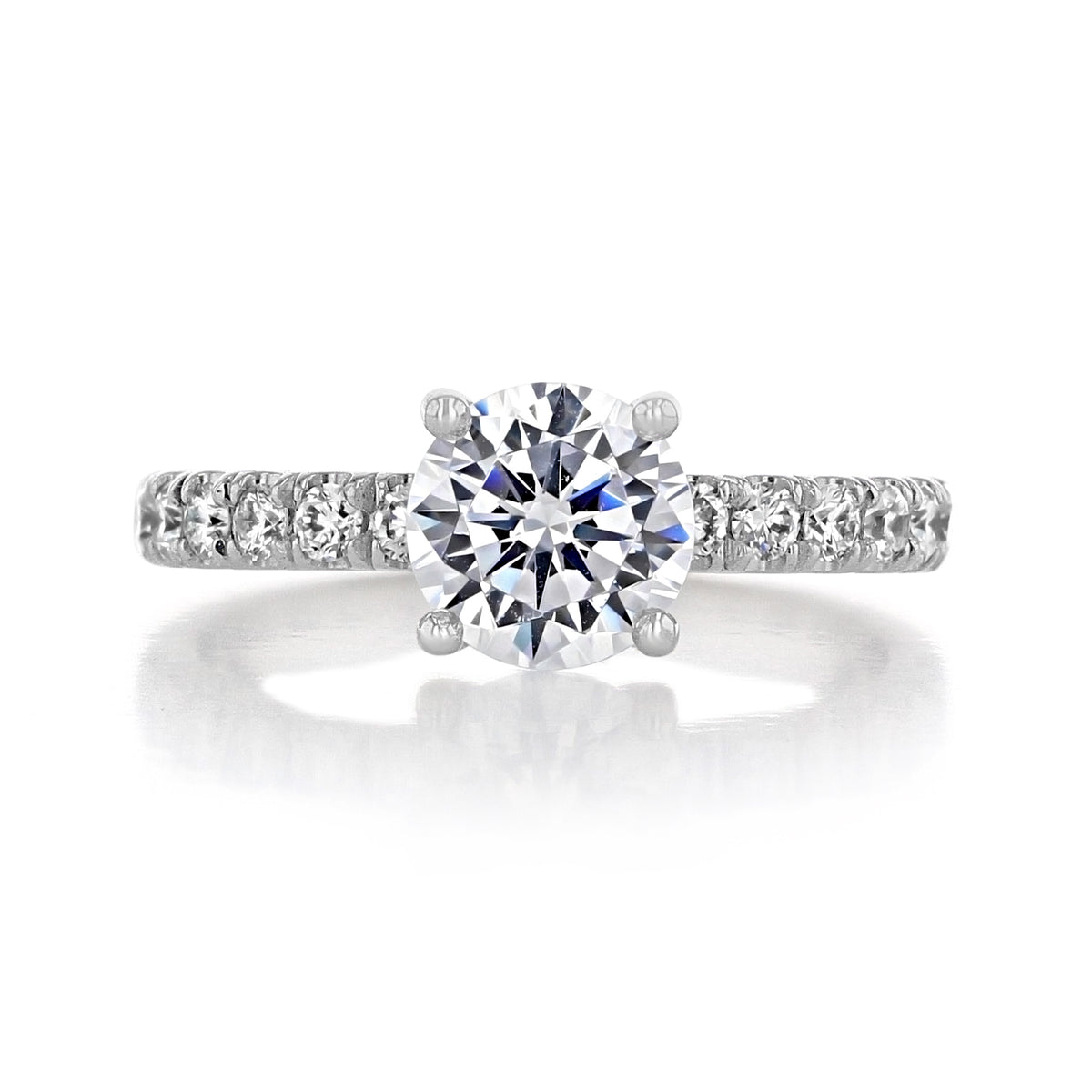 Cambria | Round Micro-Prong Engagement Ring featuring a classic round diamond and a micro-prong pavé band.