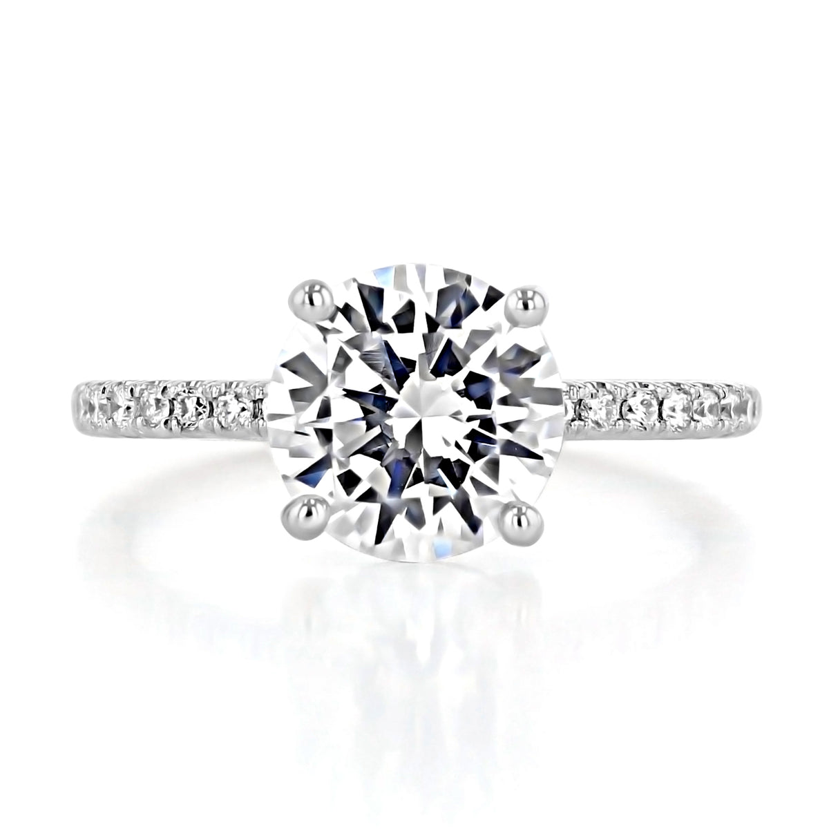 Melrose | Round Micro-Prong Engagement Ring featuring a round solitaire diamond with a four-prong setting and a micro-prong pavé band.