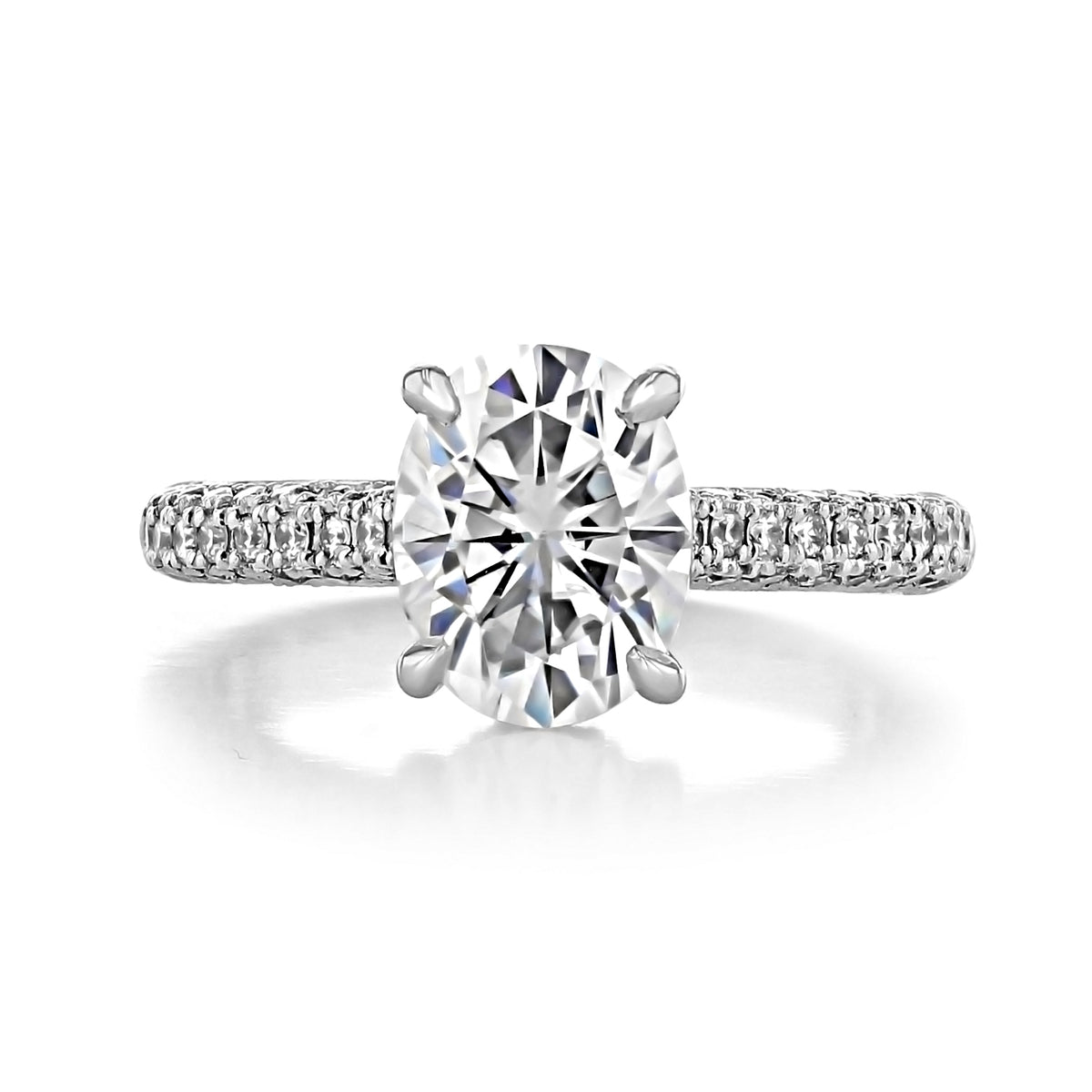 Pear Moissanite Hidden Halo Engagement Ring | EV30PS featuring an oval-cut stone and a pavé-set diamond band.