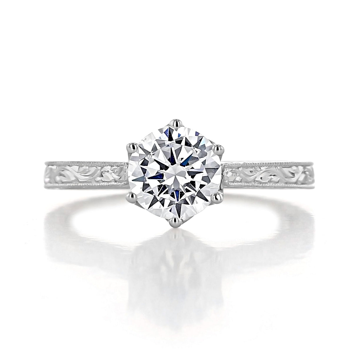 Napa | Round 6-Prong Engraved Engagement Ring featuring a vintage-inspired round solitaire diamond in a six-prong tulip setting on a metal band with engraved scrollwork detailing.