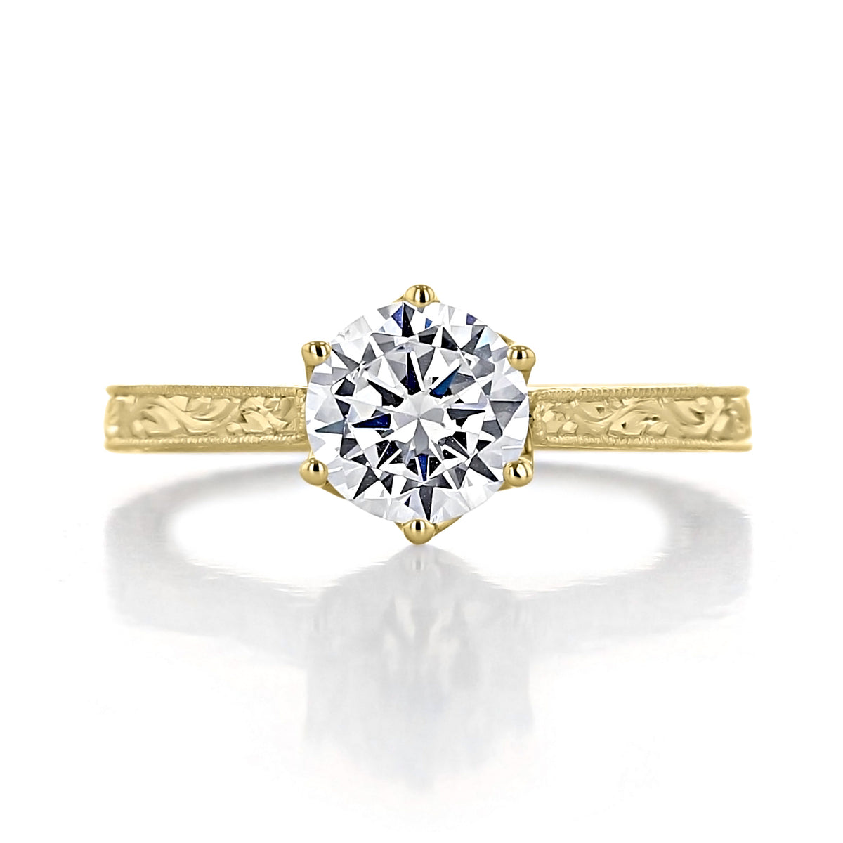 Napa | Round 6-Prong Engraved Engagement Ring featuring a round solitaire diamond in a vintage-inspired tulip setting on a gold band with an engraved scroll pattern.