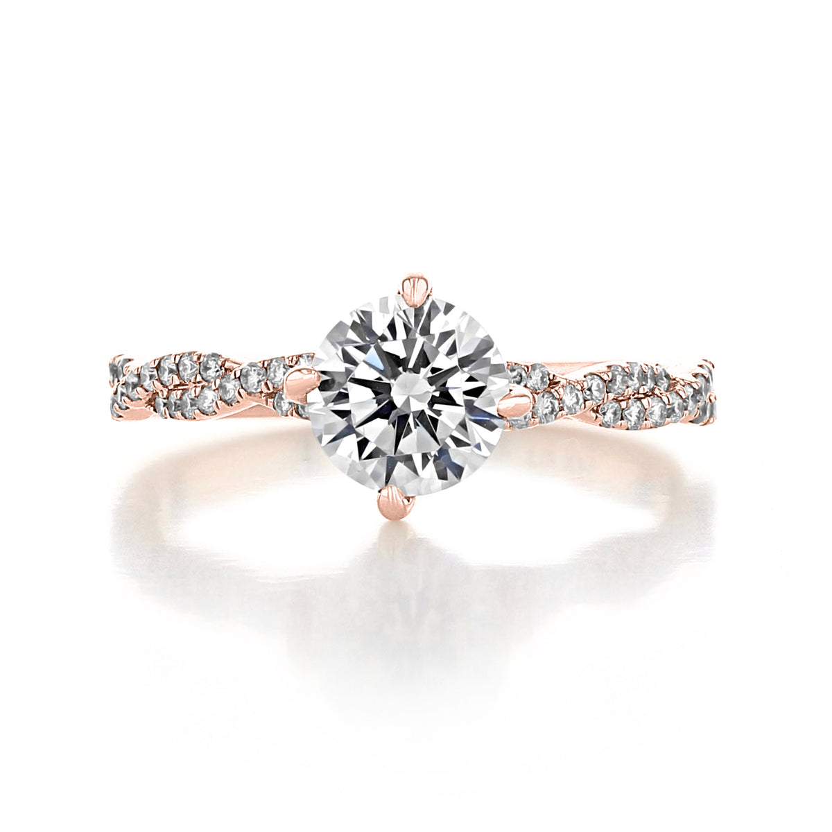 Aurora | Round Twist Engagement Ring featuring a round brilliant-cut diamond in an East-West prong setting on a twisted pavé band.