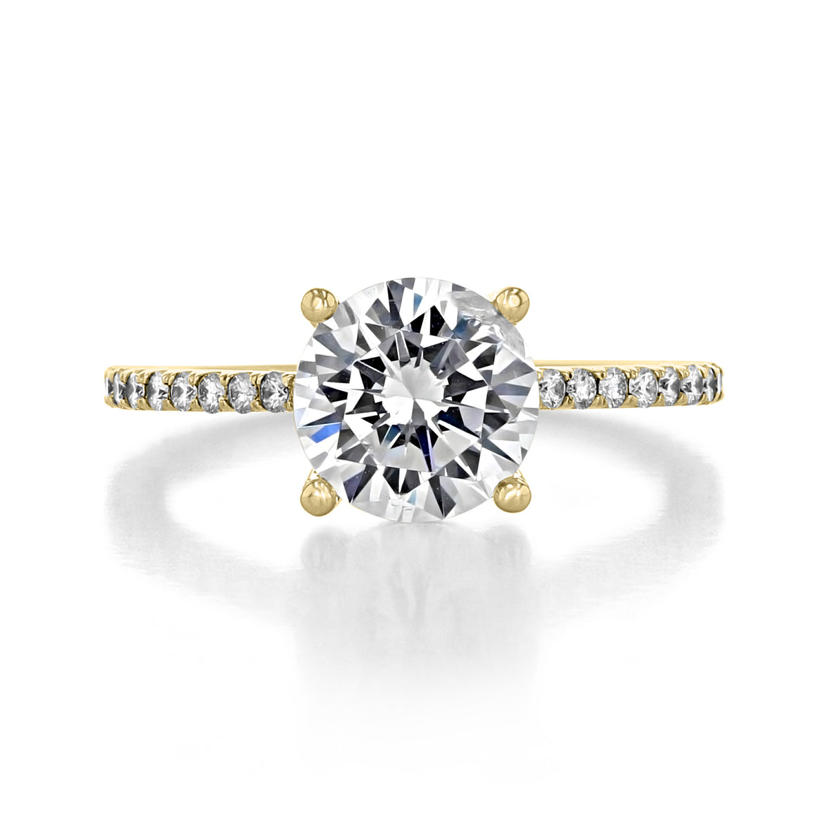 Lucerne | Round Micro-Prong Engagement Ring featuring a round center diamond and a gold band with micro-prong, pavé-set diamonds.