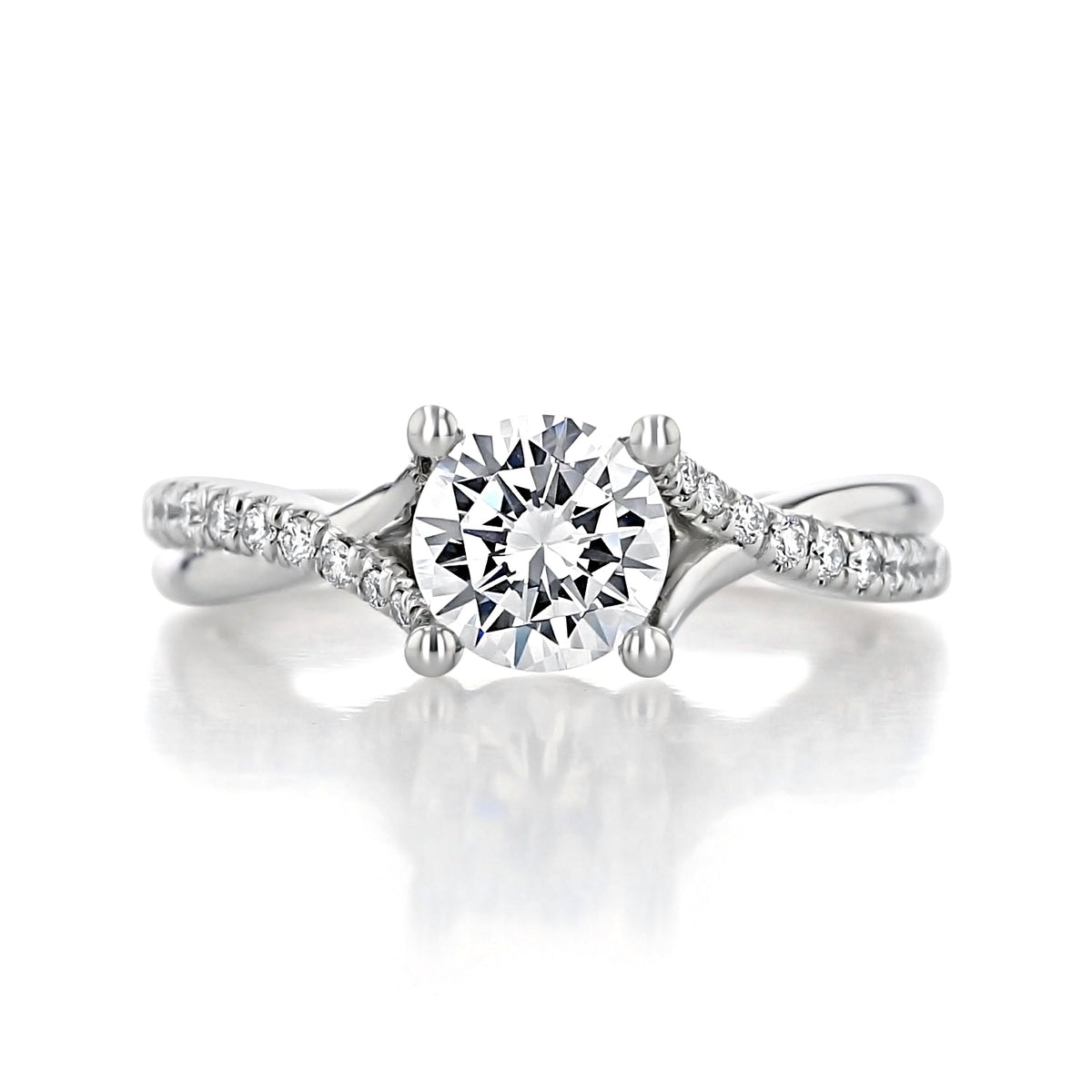 Leigh | Micro-Prong Engagement Ring by Gabriel & Co. featuring a round center diamond held by four prongs on a split-shank band accented with microprong diamonds.