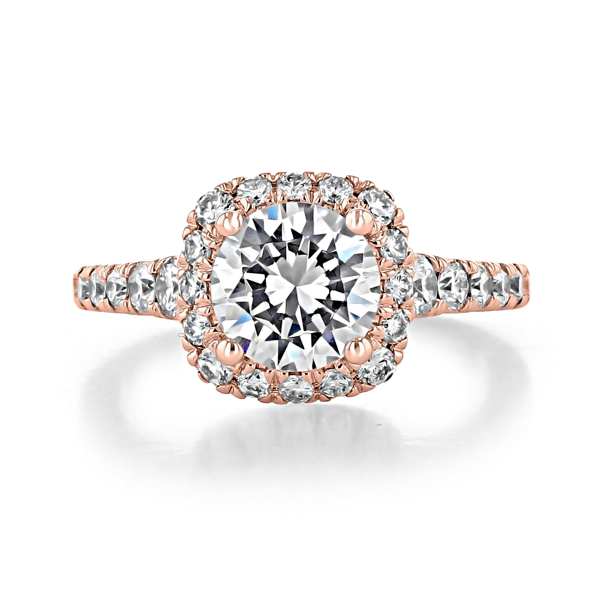 Hazel Halo Engagement Ring by Gabriel & Co. featuring a round-cut center diamond in a cushion-shaped halo setting on a rose gold band encrusted with smaller diamonds.