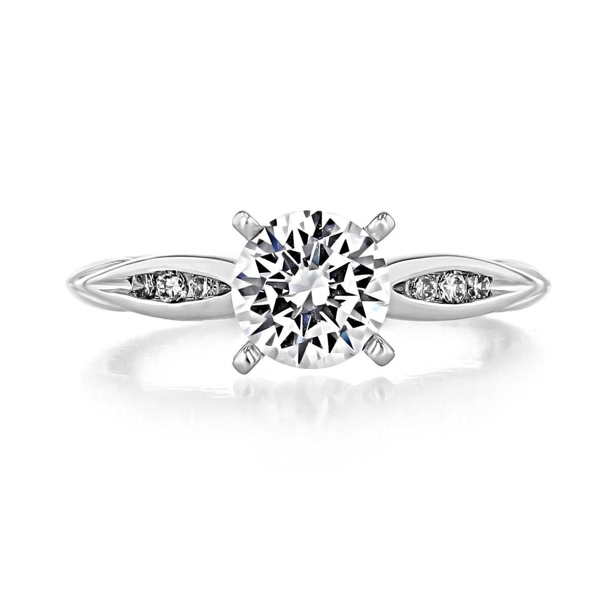 Quinn | Channel Set Engagement Ring by Gabriel & Co. featuring a round-cut diamond with three small channel-set stones on each side of the band.